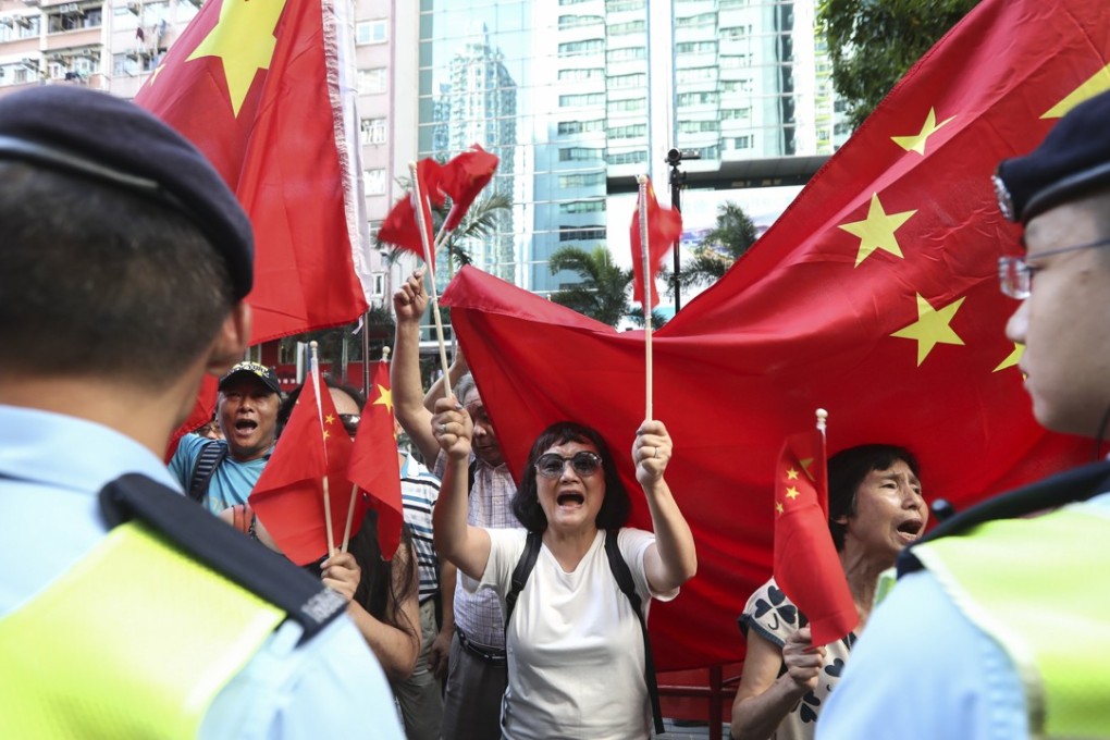 People cheering for President Xi Jinping's visit during the 20th anniversary of Hong Kong’s return to Chinese rule. Photo: Nora Tam