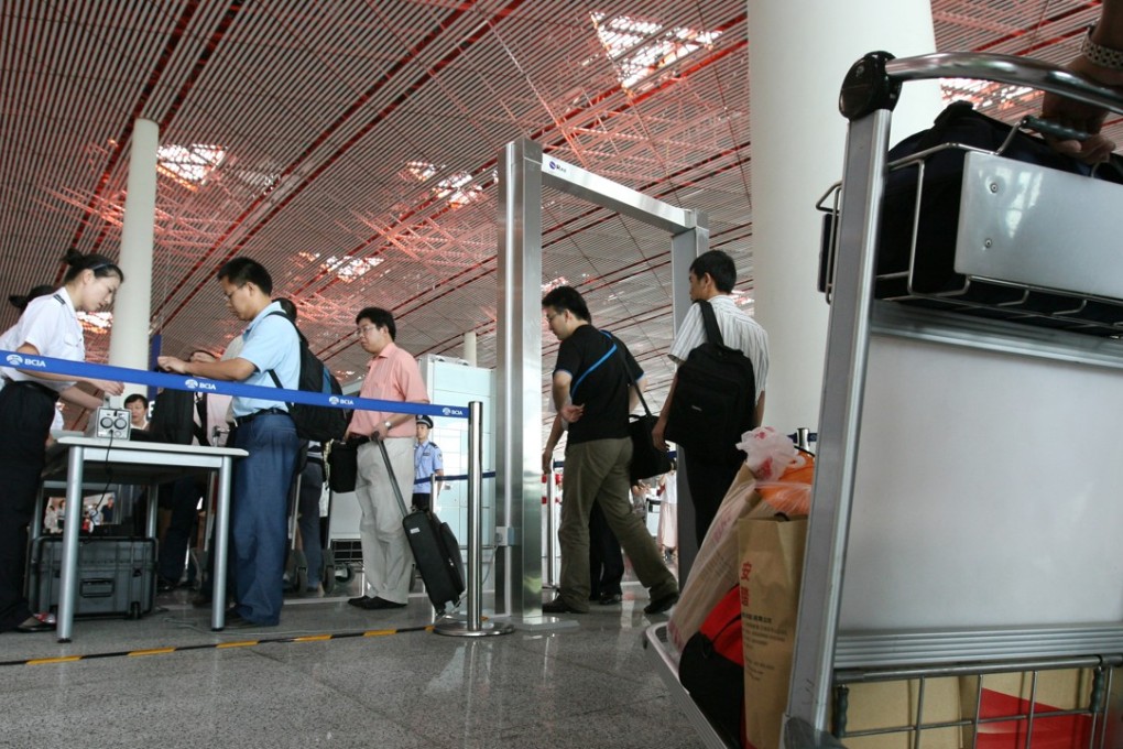 Passengers wait in lines to pass through customs of Beijing's International Airport. Some travellers from China are downloading VPN apps while overseas that allow them unfiltered access to the internet. Handout photo