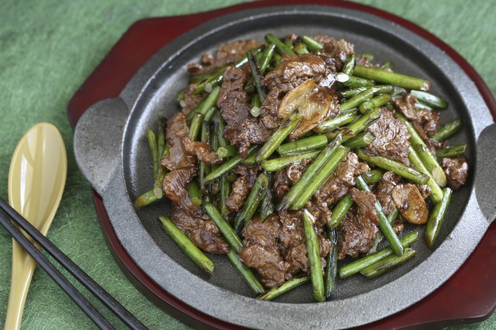Stir-fried beef and garlic scapes. Photography: Jonathan Wong. Styling: Nellie Ming Lee