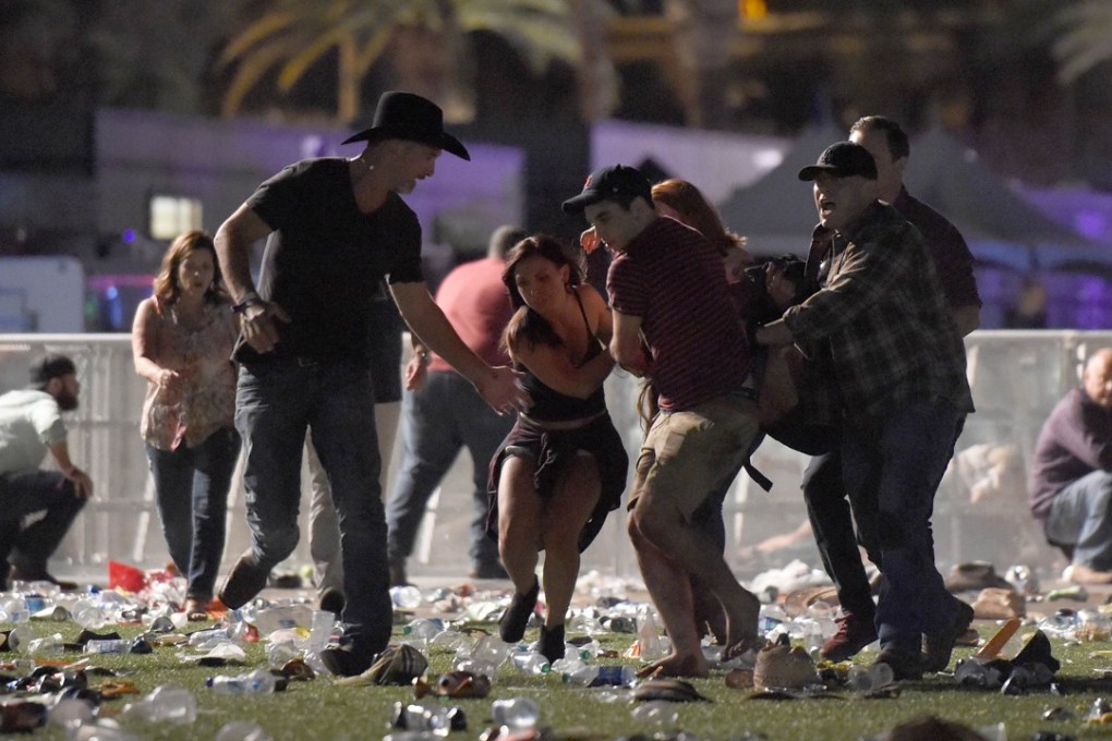 People flee from flying bullets at a country music festival in Las Vegas on Sunday during the worst mass shooting in modern US history. Photo: AFP