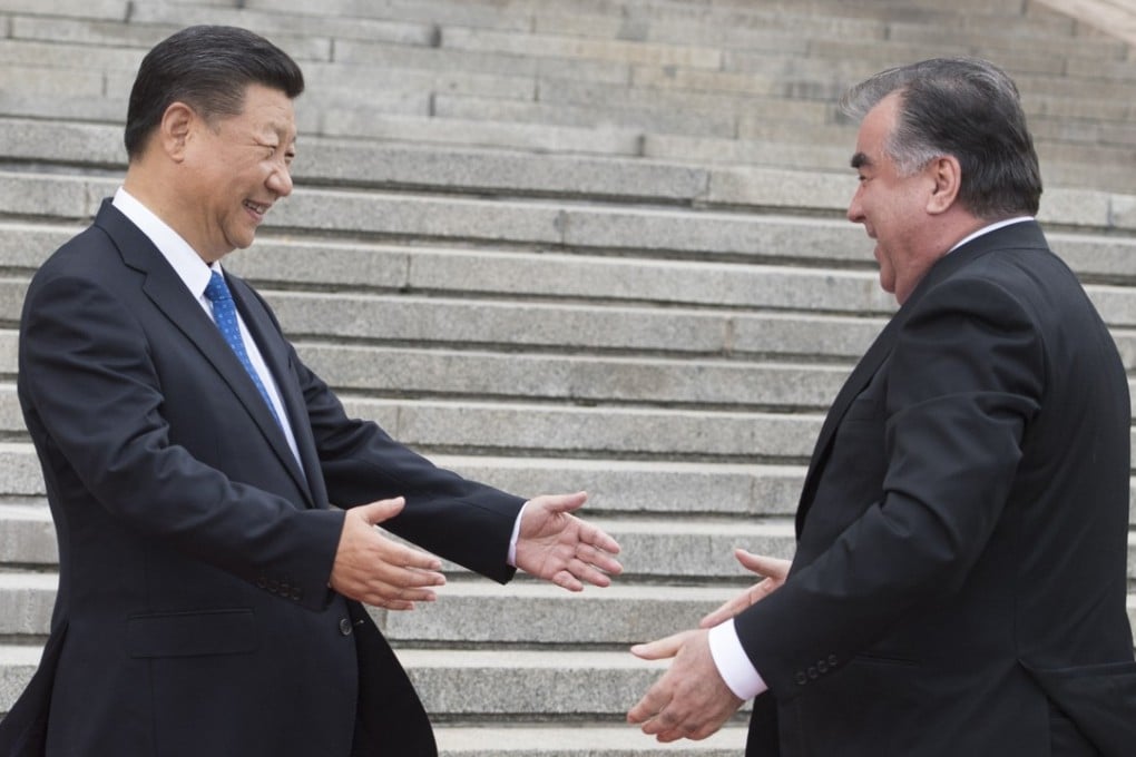 President Xi Jinping (left) greets Tajik President Emomali Rahmon in Beijing in August. Photo: Xinhua
