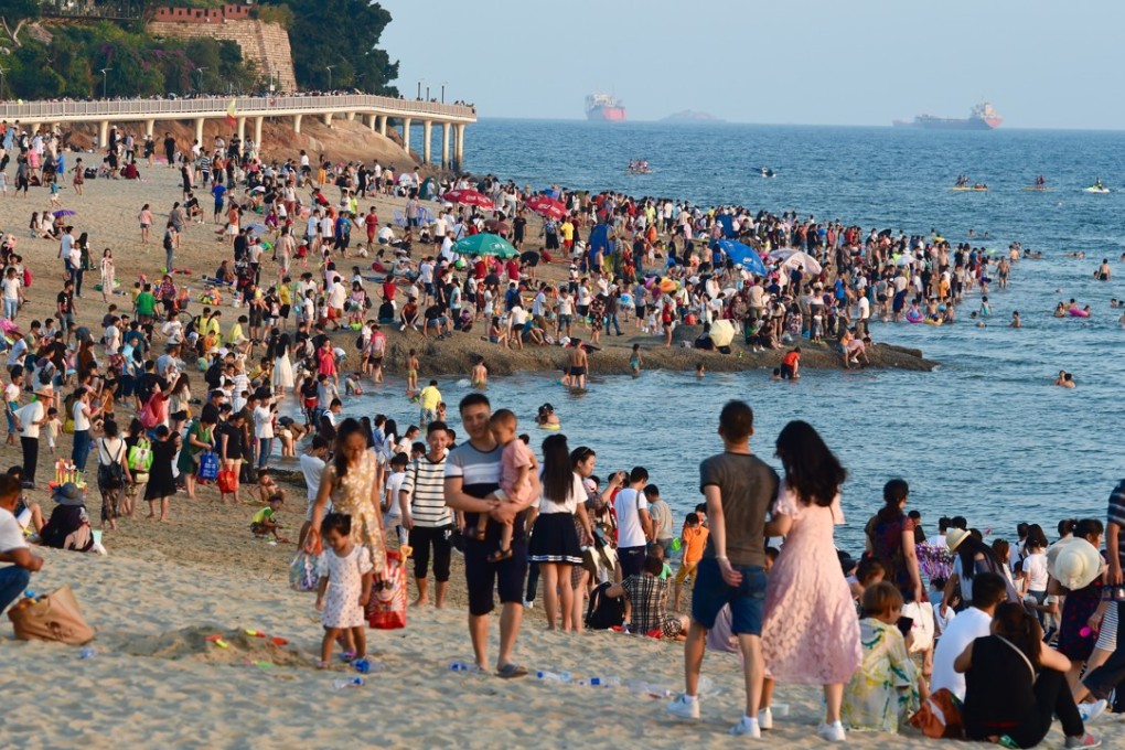 Holidaymakers soak up the sun in Xiamen, Fujian province, at the start of the week-long break. Photo: Xinhua