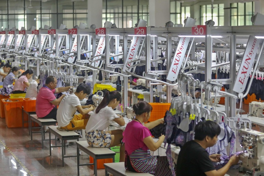Workers making swimwear at a factory in Jinjiang, in China's Fujian province. Photo: AFP
