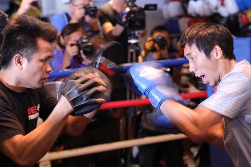 Rex Tso hits the mitts with Jake Verano during Sunday’s open workout at DEF gym. Photos: Unus Alladin