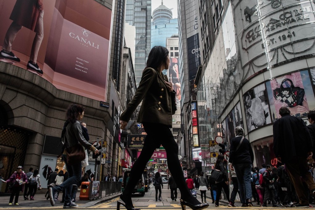 These days, many of Hong Kong’s rich workers are clocking up similar hours to the city’s poor. Photo: AFP