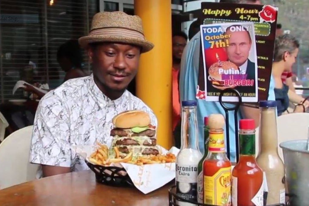 A supposed Putin burger is served at Lucy’s Cantina Royale in New York. But the restaurant says such a menu item never existed, and it was duped by a barmaid who said she was filming a project for school. Photo: YouTube / Ruptly