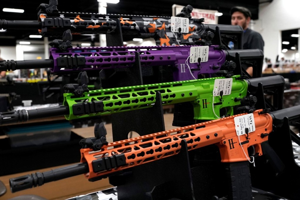 AR-15 rifles with colourful hand guards are displayed for sale at the Guntoberfest gun show in Oaks, Pennsylvania, on Friday. Photo: Reuters
