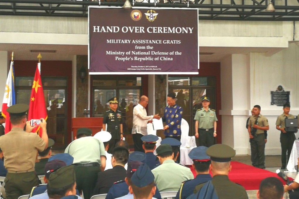 Last week’s ceremony featured a banner with the logo of the Taiwanese defence ministry (right-hand side). Photo: CNS