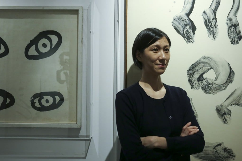 Lesley Ma, curator of ink art at Hong Kong’s M+ museum of visual culture. In the background are works by Japanese artist Hidai Nankoku. Photo: Jonathan Wong