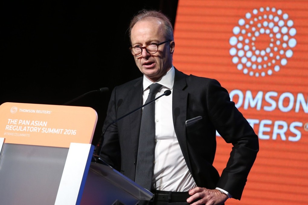 SFC chief executive Ashley Alder announced a plan to share information with its mainland Chinese counterpart. Photo: K. Y. Cheng