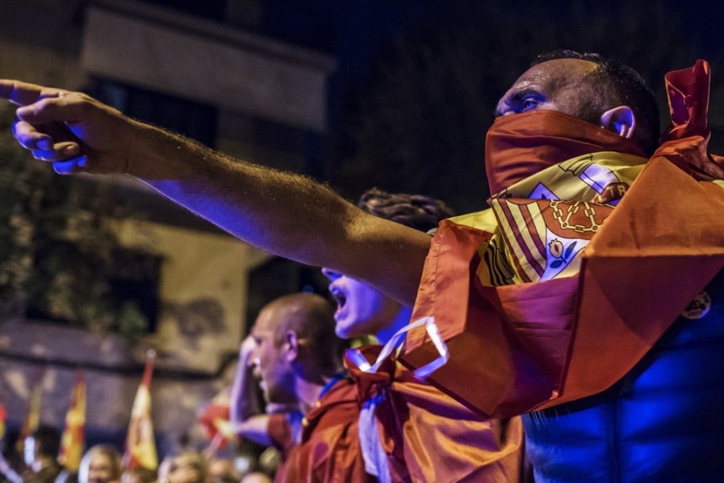 Pro-union demonstrators rally in the Barcelona province, protesting against Catalonia’s bid for independence. Photo: Bloomberg