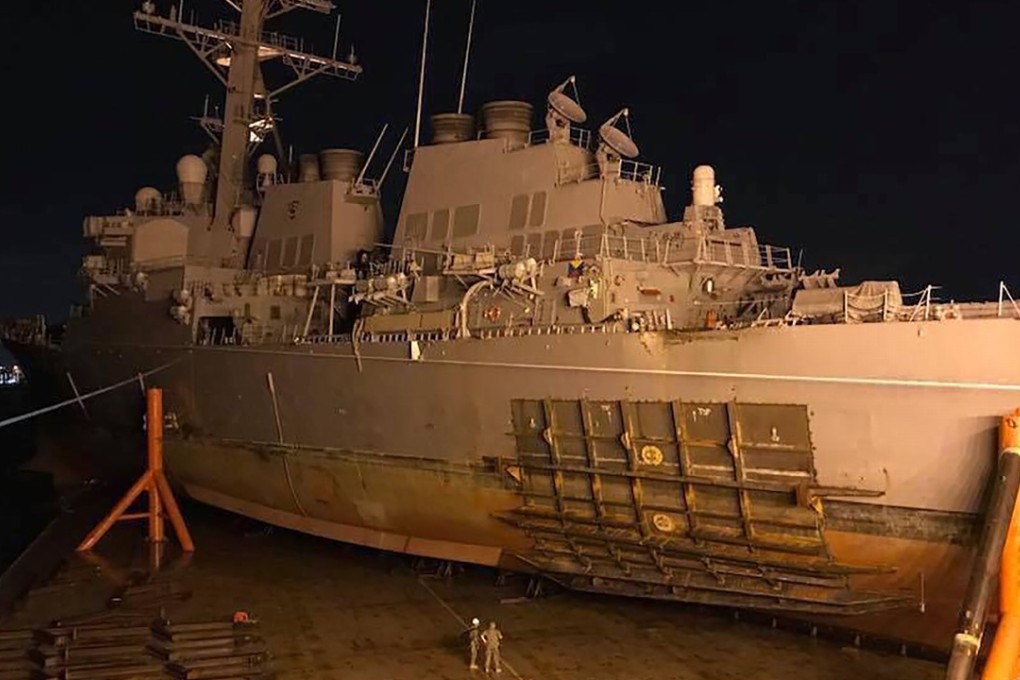 The guided missile destroyer USS John S. McCain loaded onto heavy lift transport MV Treasure at sea. The USS John S. McCain collided with a tanker on August 21, 2017 as the destroyer headed to Singapore, tearing a huge hole in the hull. Photo: AFP