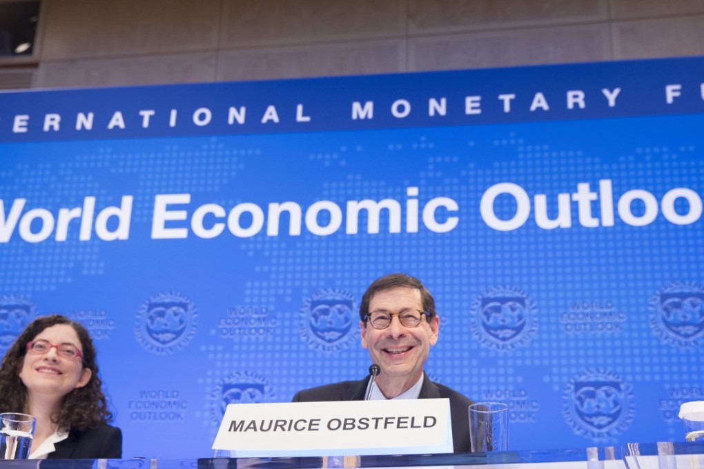 International Monetary Fund (IMF) chief economist Maurice Obstfeld (R) and Chief of the World Economic Studies Oya Celasun (L) share a laugh as they answer questions during the World Economic Outlook Press Conference at the IMF Headquarters during the 2017 IMF/World Bank Annual Meetings on October 10, 2017 in Washington. Photo: IMF handout via EPA-EFE