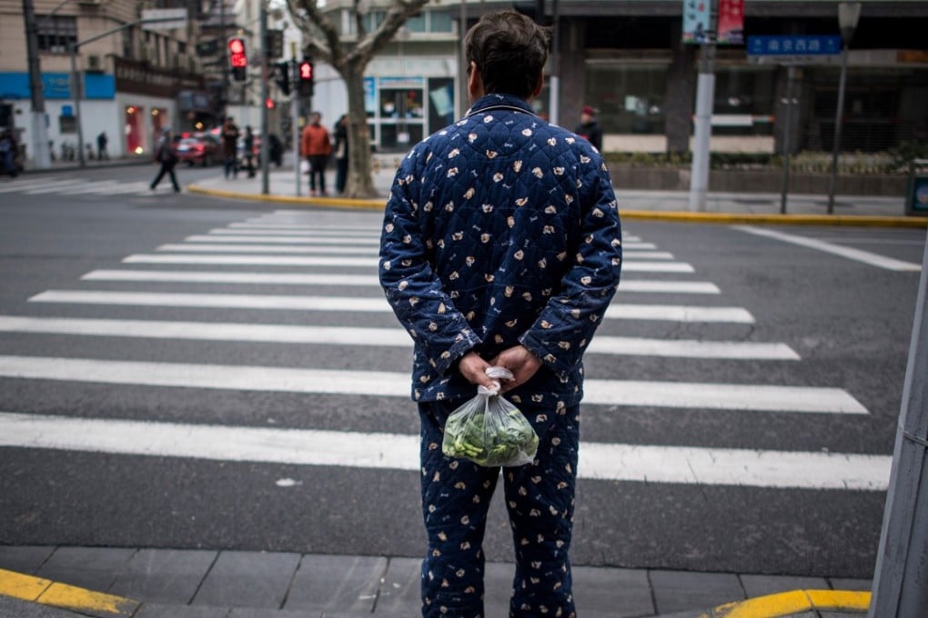 A man wearing pyjamas in Shanghai. Picture: AFP