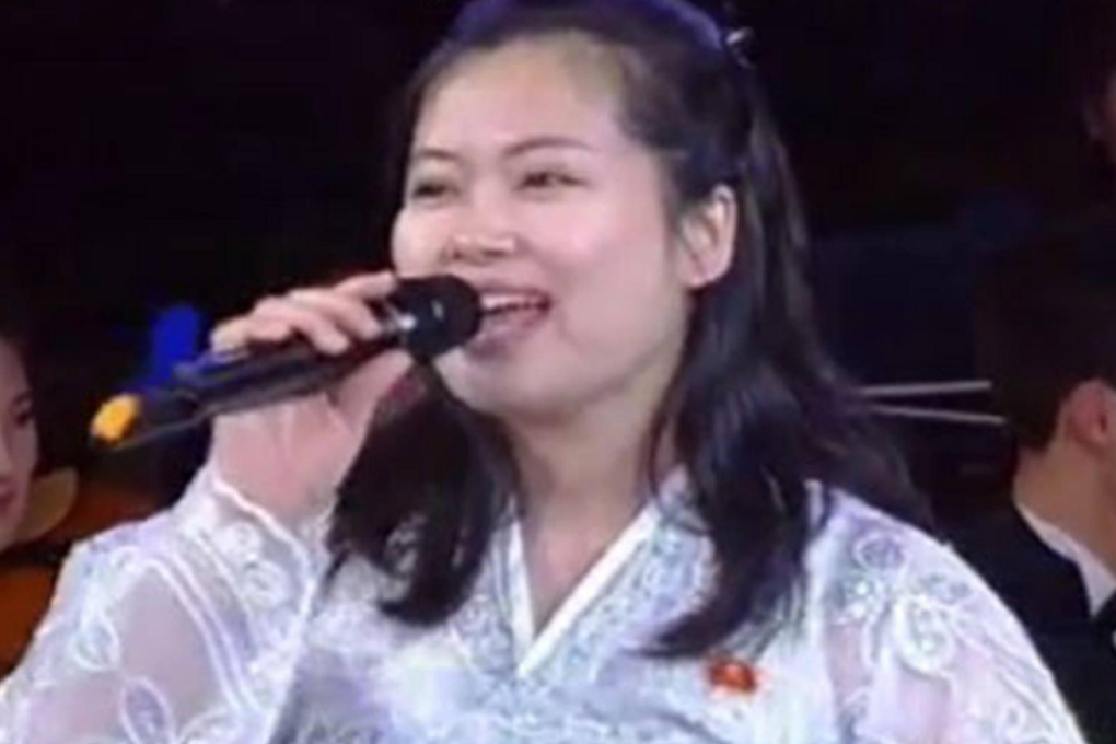 Hyon Song-wol on television delivering a speech at a national art workers' rally in Pyongyang.