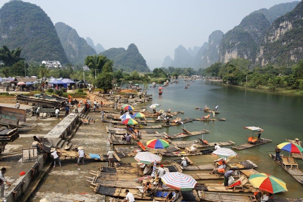 Bamboo tourist rafts in Yangshuo, in southwest China’s Guangxi autonomous region. Pictures: Alamy