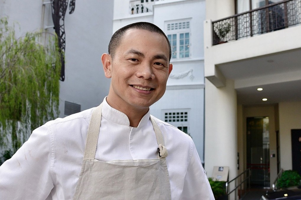 Chef-owner Andre Chiang, outside his two-Michelin-starred restaurant "Andre" in Singapore, has announced he wants to be stripped of the honour and will close his popular eatery, the latest restaurateur to walk away from the culinary distinction. Photo: AFP /The Strait Times