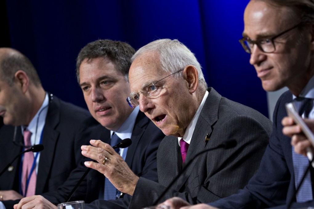 German finance minister Wolfgang Schaeuble, second right, speaks and defends globalisation at the annual IMF-World Bank meetings in Washington. Photo: Bloomberg