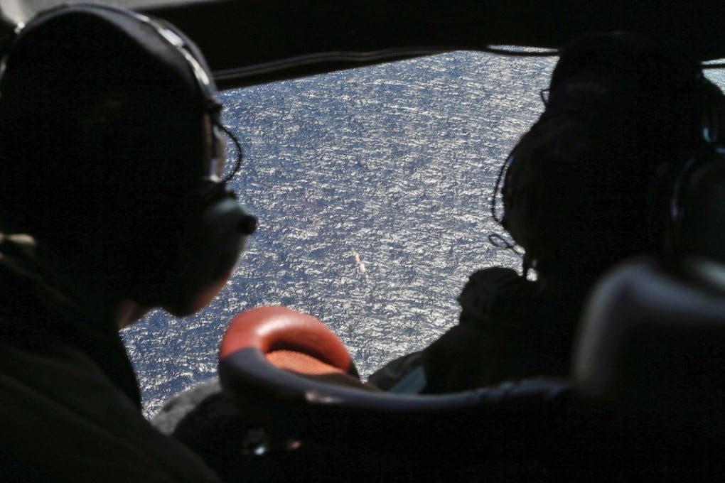 A search team looks for MH370. Photo: AFP