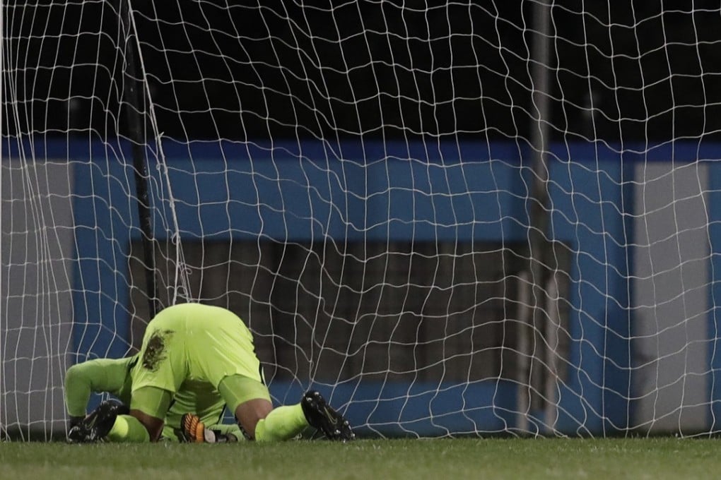 US goalkeeper Tim Howard cannot stop the humiliation – and World Cup qualification destroyed by Trinidad and Tobago. Photo: AP