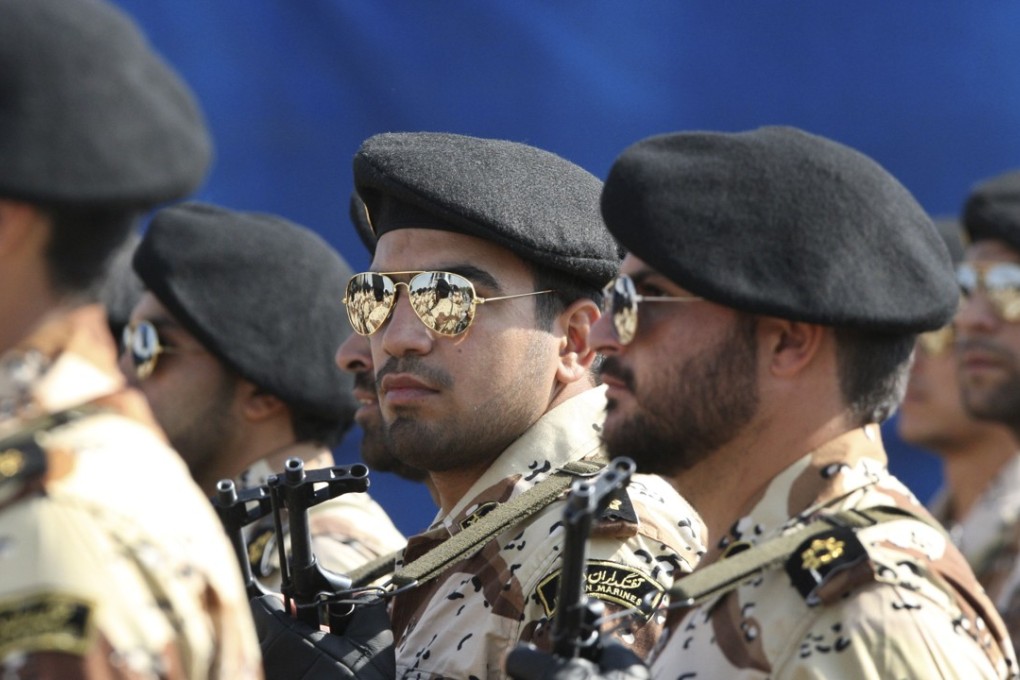 Members of Iran's Revolutionary Guard march in front of the mausoleum of the late Iranian revolutionary founder Ayatollah Khomeini, just outside Tehran, Iran. File photo: AP