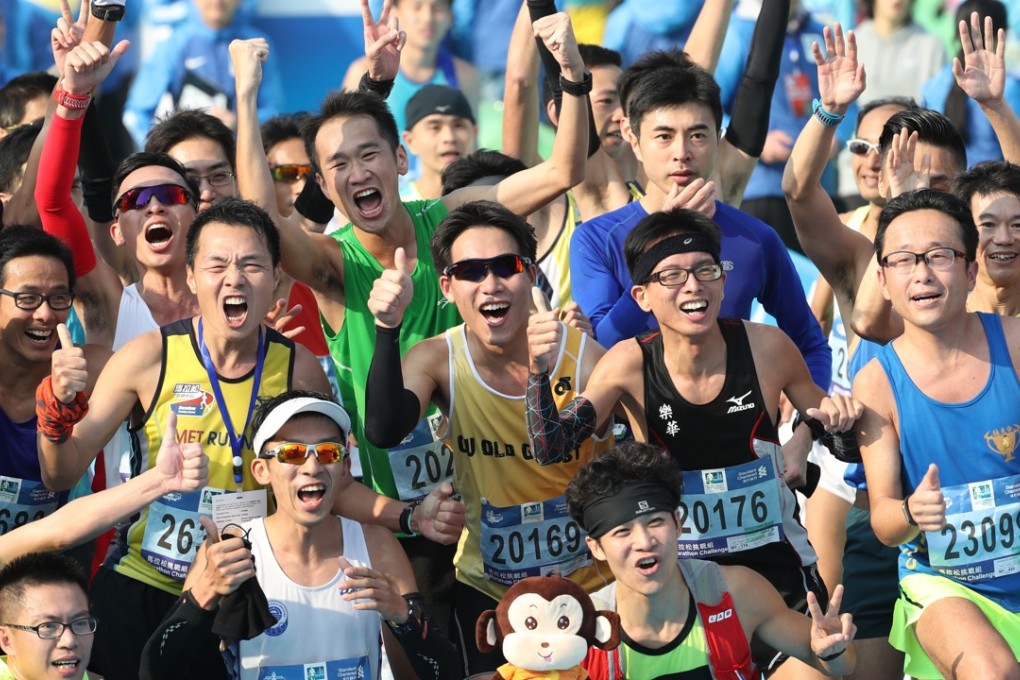 Standard Chartered Hong Kong Marathon participants cross the finish line at Victoria Park in Causeway Bay earlier this year. Photo: Nora Tam