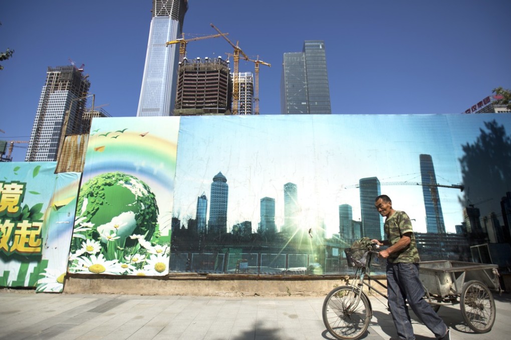 A man pushes a cart past a construction site in the central business district in Beijing. The popularity of investing in China is having an effect on prices. Photo: AP