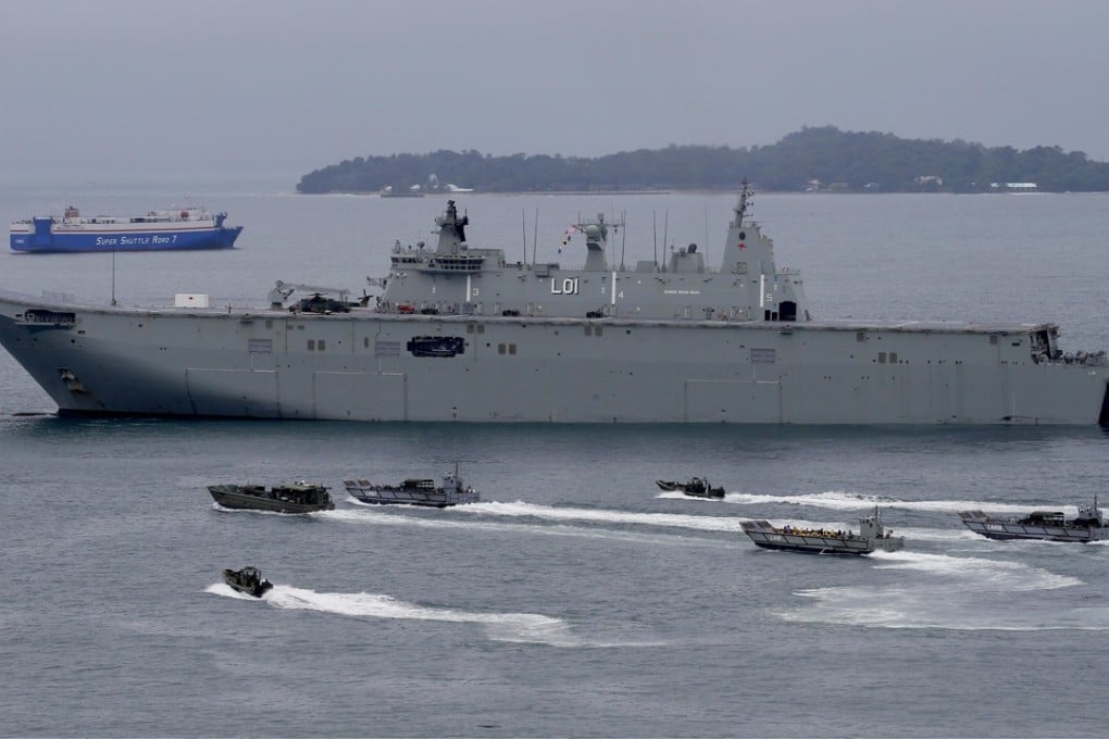 The Royal Australian Navy’s HMAS Adelaide with landing crafts carrying Philippine marines and Australian troops off Subic Bay, north of Manila. Photo: AP
