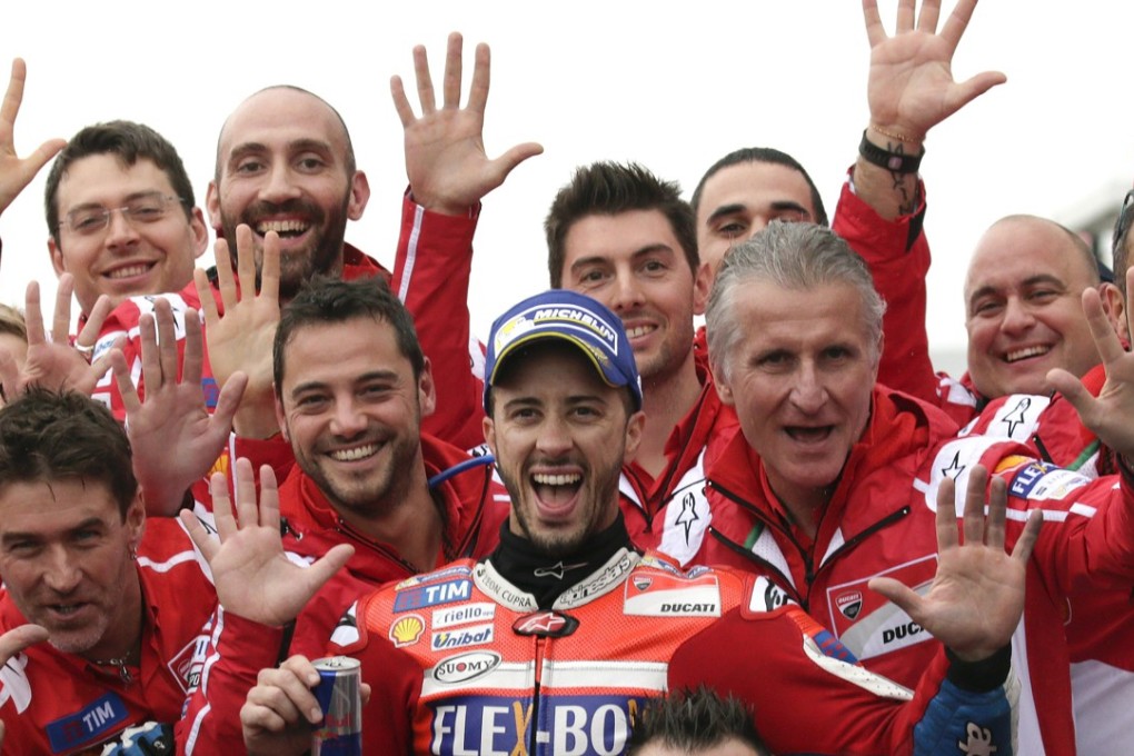 Italian MotoGP rider Andrea Dovizioso of Ducati celebrates with his team. Photo: EPA