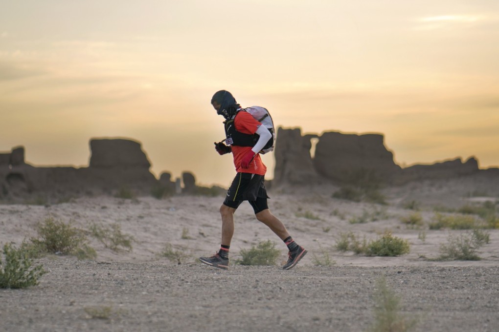 English ultramarathon runner Dan Lawson conquering the 2017 Ultra Gobi, a 400km non-stop, self-navigating race in Gansu province, China. Lawson won in record time. Photo: Lloyd Belcher Visuals