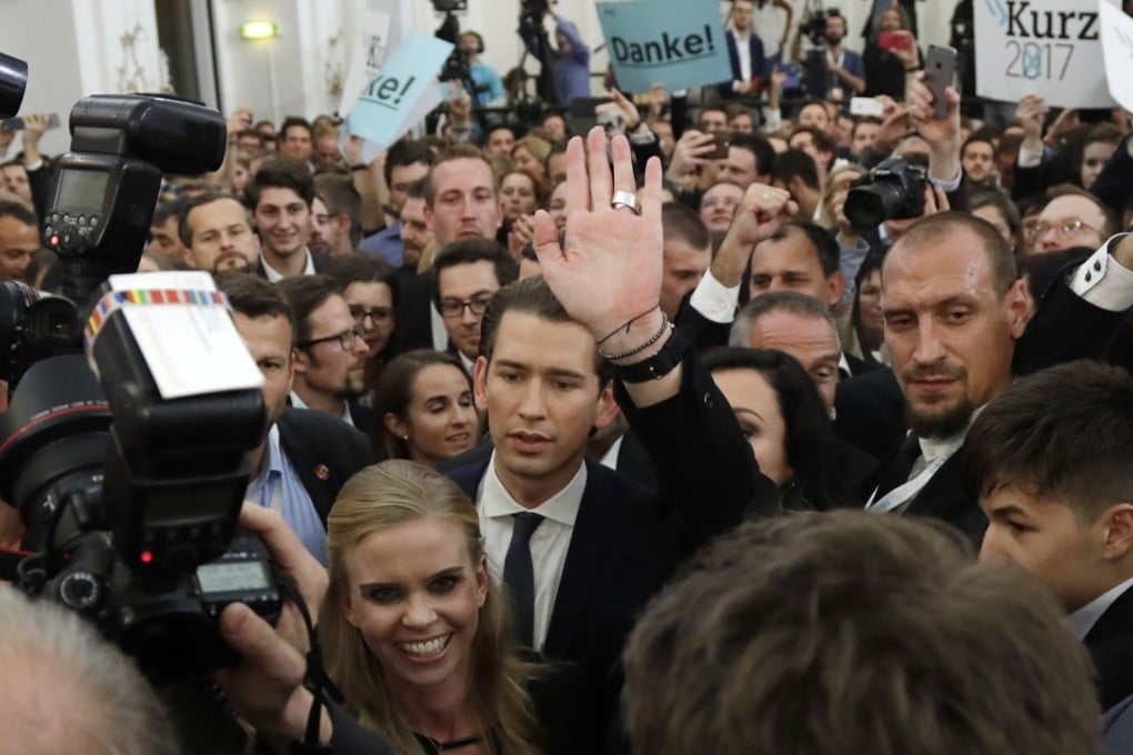 Foreign Minister Sebastian Kurz (centre) head of the Austrian People's Party, arrives at an election party in Vienna on Sunday. Photo: AP