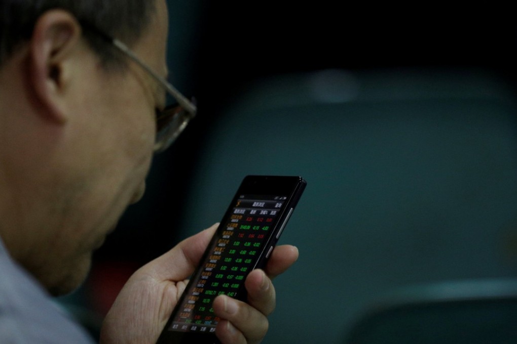 Mobile phones are used for everything from circulating research to making traders. Photo: Reuters