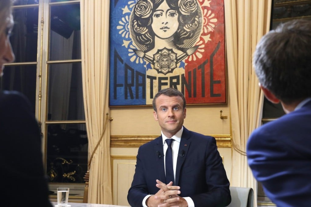 French President Emmanuel Macron (C) is interviewed at the Elysee Palace in Paris, France, on Sunday, October 15, 2017. Photo: EPA-EFE