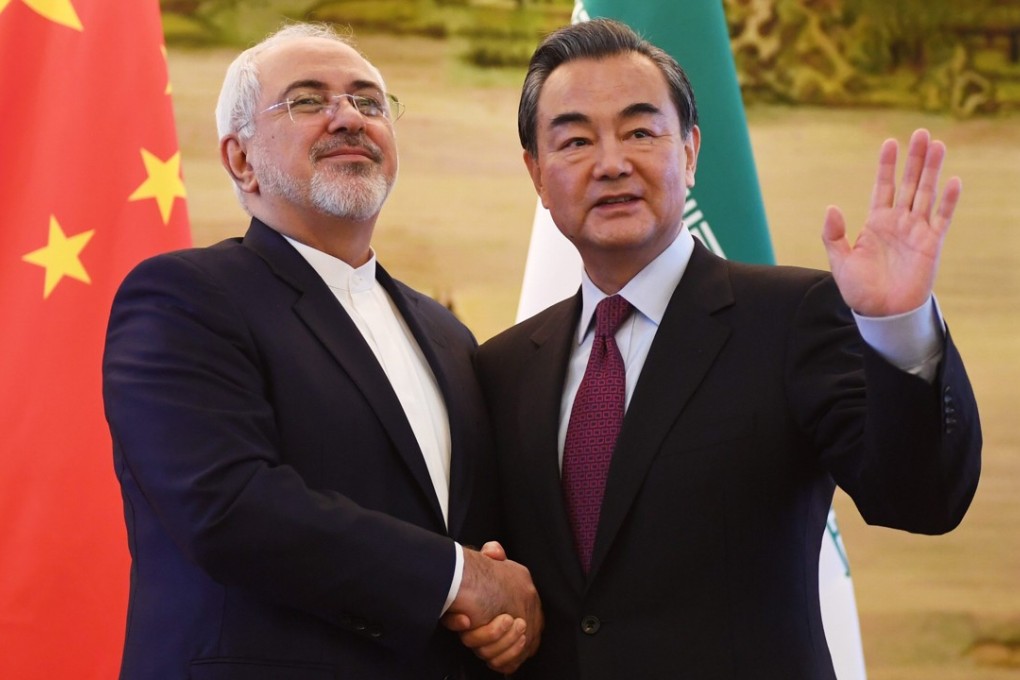 Iranian Foreign Minister Mohammad Javad Zarif (left) shakes hands with Chinese Foreign Minister Wang Yi after a joint media briefing in 2016. China and Iran have close economic, trade and energy ties. Photo: EPA