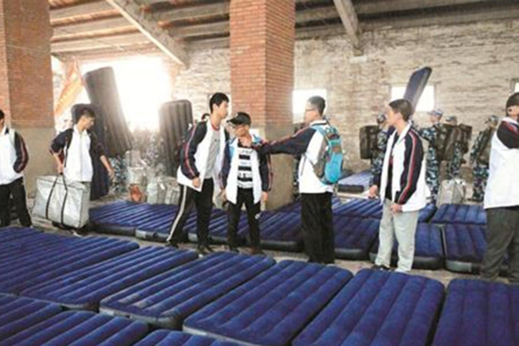Pupils inspect their makeshift lodgings. Photo: Thepaper