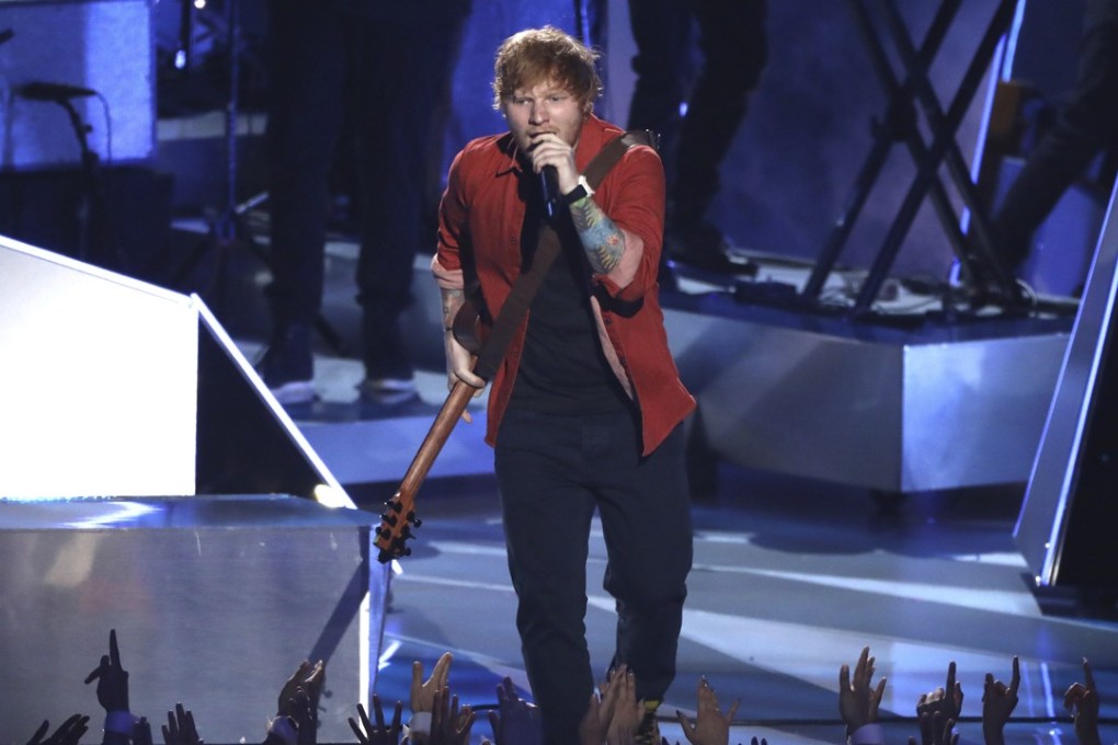 Ed Sheeran is known for playing on stage with just his guitar. Photo: AP