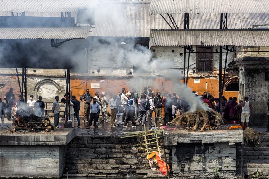 A cremation ceremony takes place at Pashupatinath Temple in Kathmandu, a colourful cacophony of life – and death. Photo: Shutterstock