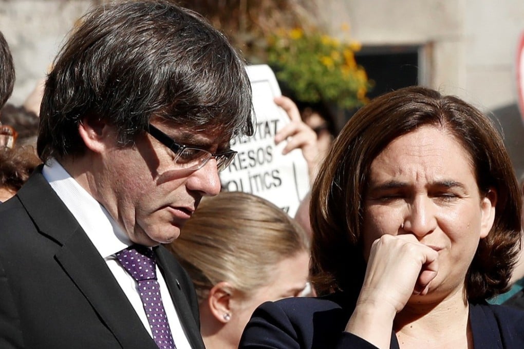 Catalan regional president Carles Puigdemont and Barcelona's Mayoress Ada Colau. The Spanish government has demanded Puigdemont clarify the region’s position on independence by Thursday. Photo: EPA