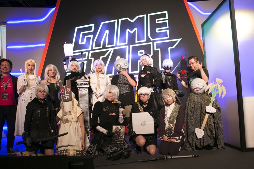 Cosplayers dressing up as characters from the video game Nier wait for judging at Singapore’s GameStart Asia convention.