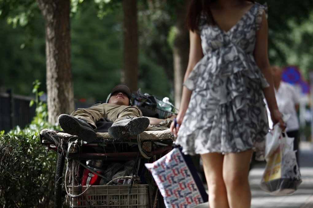 A man takes a break from collecting scrap in Beijing. President Xi Jinping said China’s “unbalanced and inadequate development” had constrained people from building better lives. Photo: Reuters