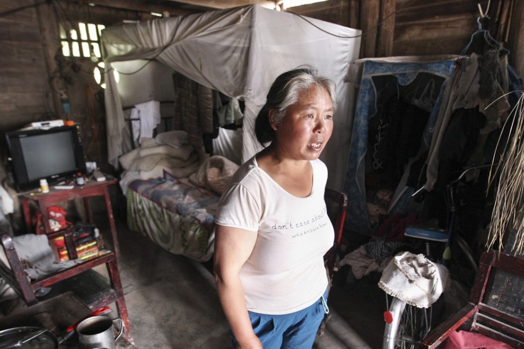 60-year-old Zhai Sifang is pictured at her home at Longtan village, Bijie city, Guizhou province. Both of Zhai’s son and daughter have left the village to work in cities, leaving her in village alone. Photo: Simon Song