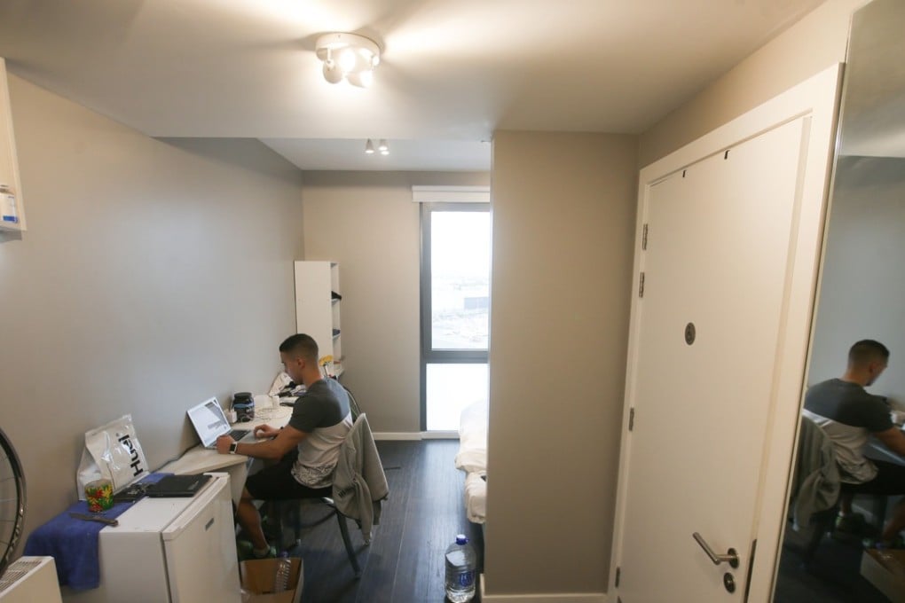 Personal trainer Adam Saez works in his flat at the co-living building The Collective Old Oak in north west London. Photo: AFP