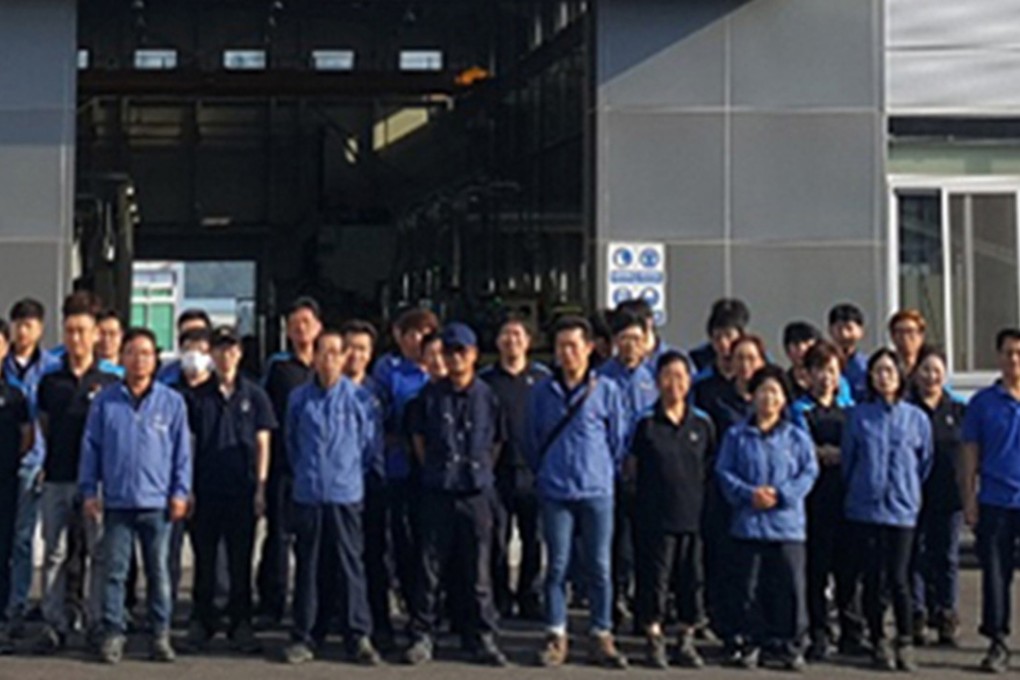 CY Group staff in front of ETR, a CY Group subsidiary