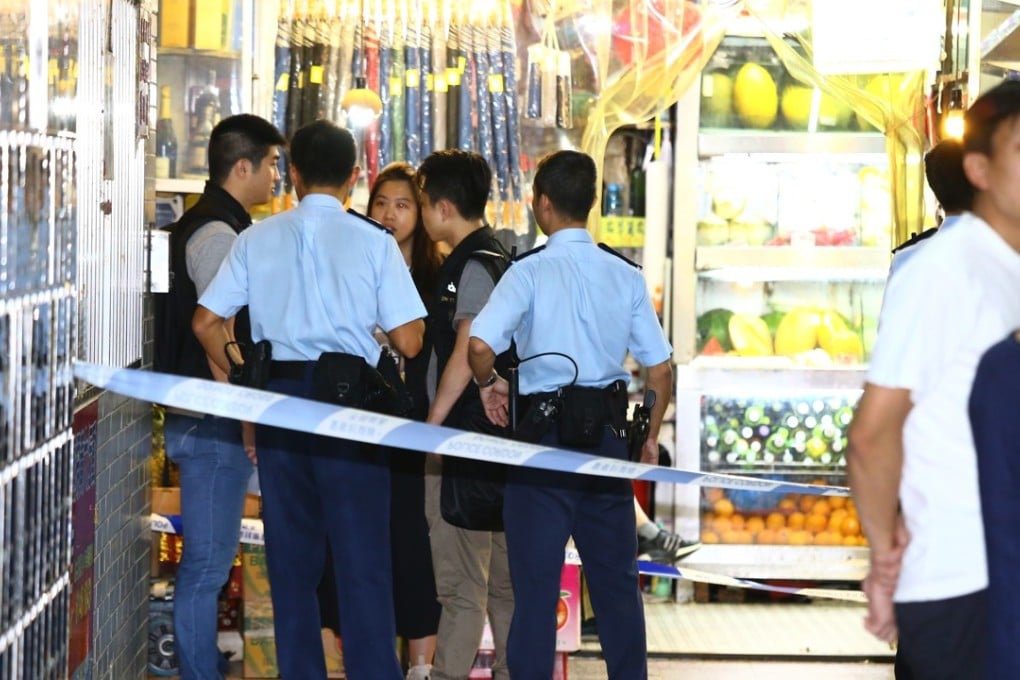Police officers at the Alhambra Building in Yau Ma Tei, where the man was subdued. Photo: Handout