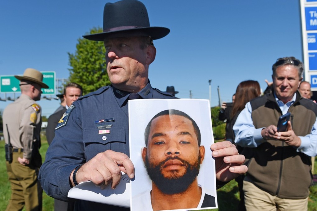 Harford County Sheriff Jeffrey Gahler shows a picture of suspect Radee Labeeb Prince, 37, after a news conference near the scene of a workplace shooting where five people were shot and three are confirmed dead on Wednesday, October 18, 2017 in Edgewood, Maryland. Photo: Baltimore Sun/TNS