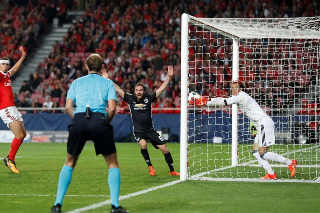 Benfica’s Mile Svilar carries the ball over the line as Manchester United sealed a 1-0 win in Benfica. Photo: Reuters