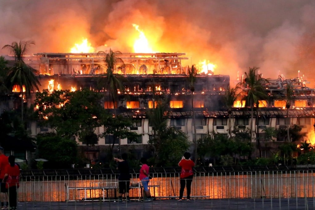 The teak upper floors of the hotel were destroyed and the fire also appeared to have swept through the cement ground and first floors. Photo: Xinhua