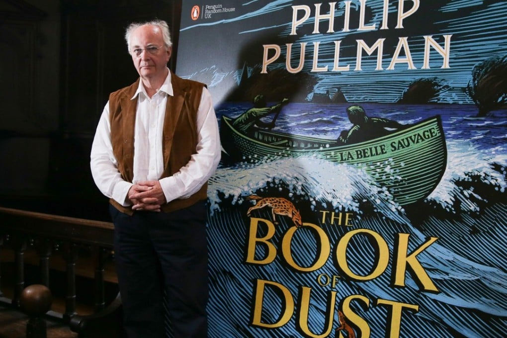 British author Philip Pullman poses with his new book La Belle Sauvage: The Book of Dust Volume One during a photo call at Convocation House, Bodleian Libraries, in Oxford on Wednesday. Photo: Agence France-Presse