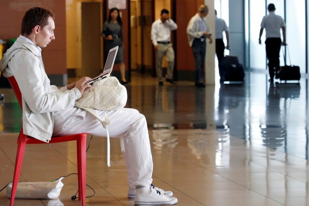 A man works on a laptop at the airport in Hanoi, Vietnam, on Wednesday. Photo: Reuters