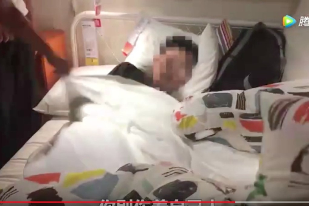 A man dozing under the sheets is woken up by the pranksters. Photo: Handout